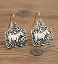 Pair of silver horse-shaped earrings