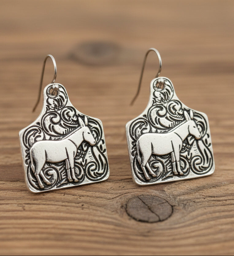 Pair of silver horse-shaped earrings
