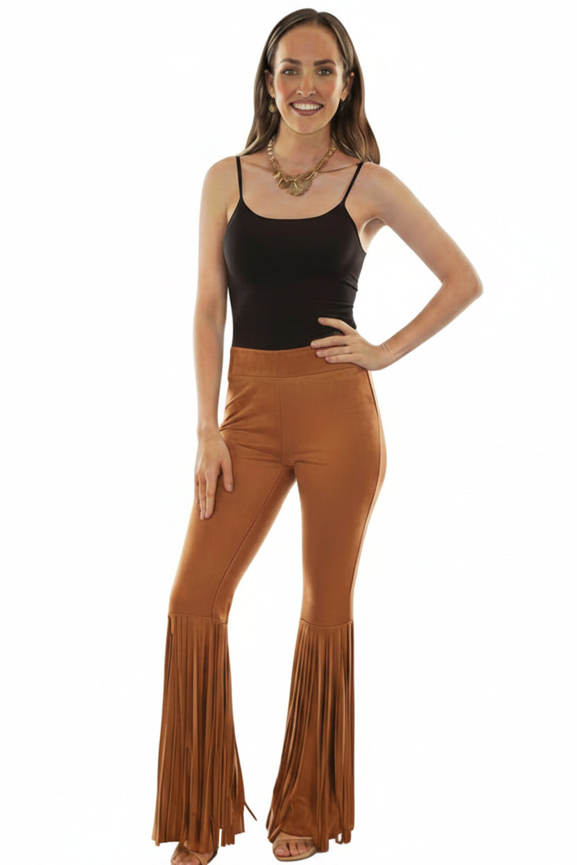 Woman wearing a black tank top and brown fringed pants 